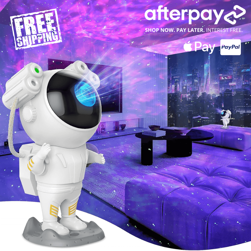 Cartoon astronaut figure standing in a purple-lit bedroom with a galaxy projector glow, promoting an astronaut galaxy projector