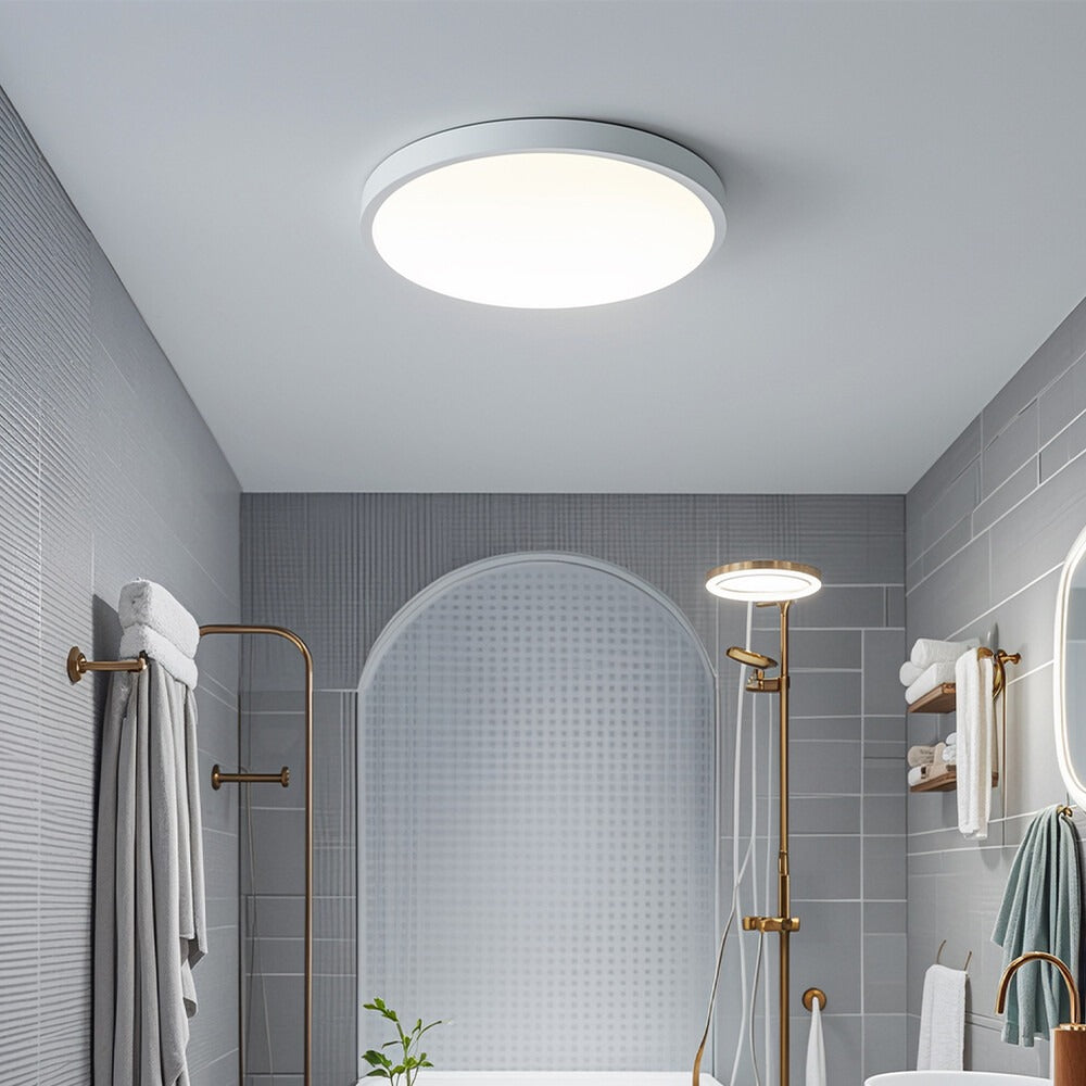 Round LED oyster ceiling light illuminating hallway with bright uniform glow